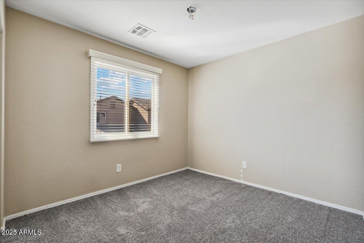 2233 East Pecan Road Phoenix, AZ 85040 - Photo 14 of 18 an empty room with a window