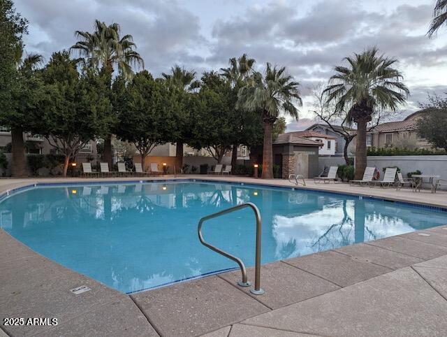 2233 East Pecan Road Phoenix, AZ 85040 - Photo 18 of 18 a view of swimming pool with outdoor seating and plants