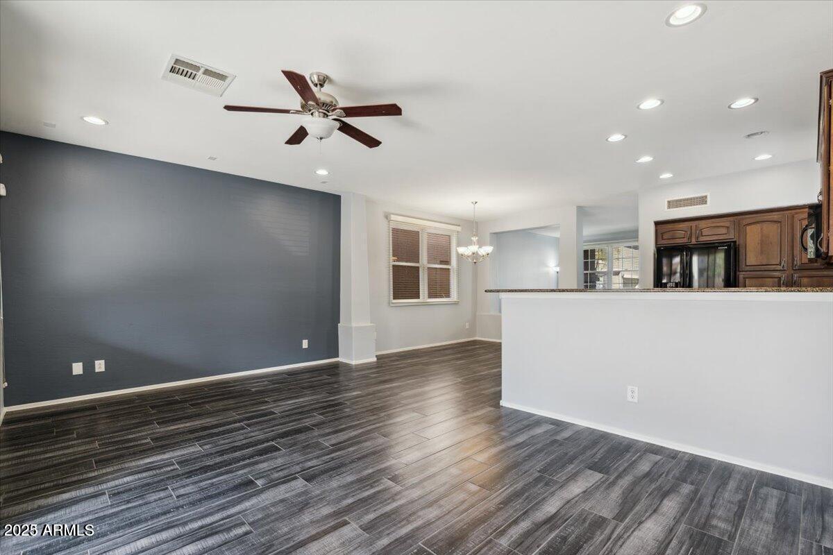 2233 East Pecan Road Phoenix, AZ 85040 - Photo 6 of 18 a view of a kitchen with a sink and dishwasher with wooden floor