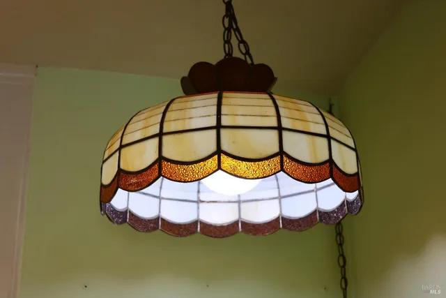 a view of a dining room with furniture and window