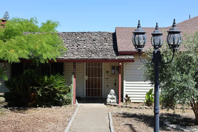 a view of a house with a garden