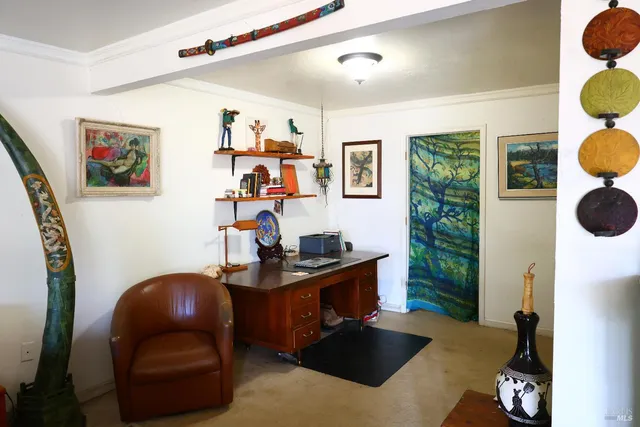 a front view of a house with outdoor seating and floor