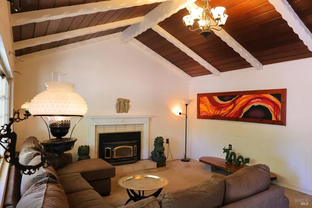 a kitchen with cabinets appliances a sink and a window