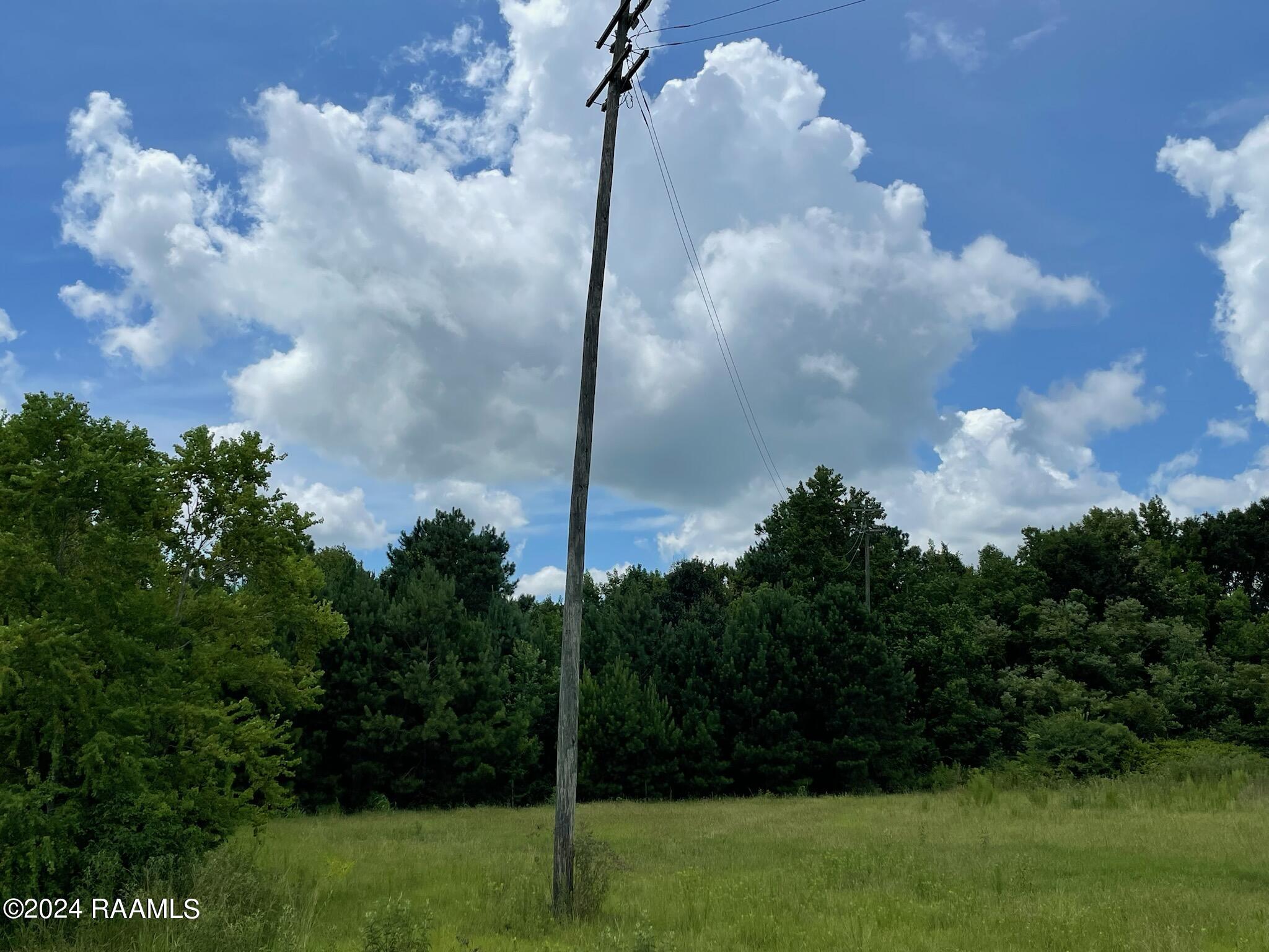 12+ acres N Grolee St side