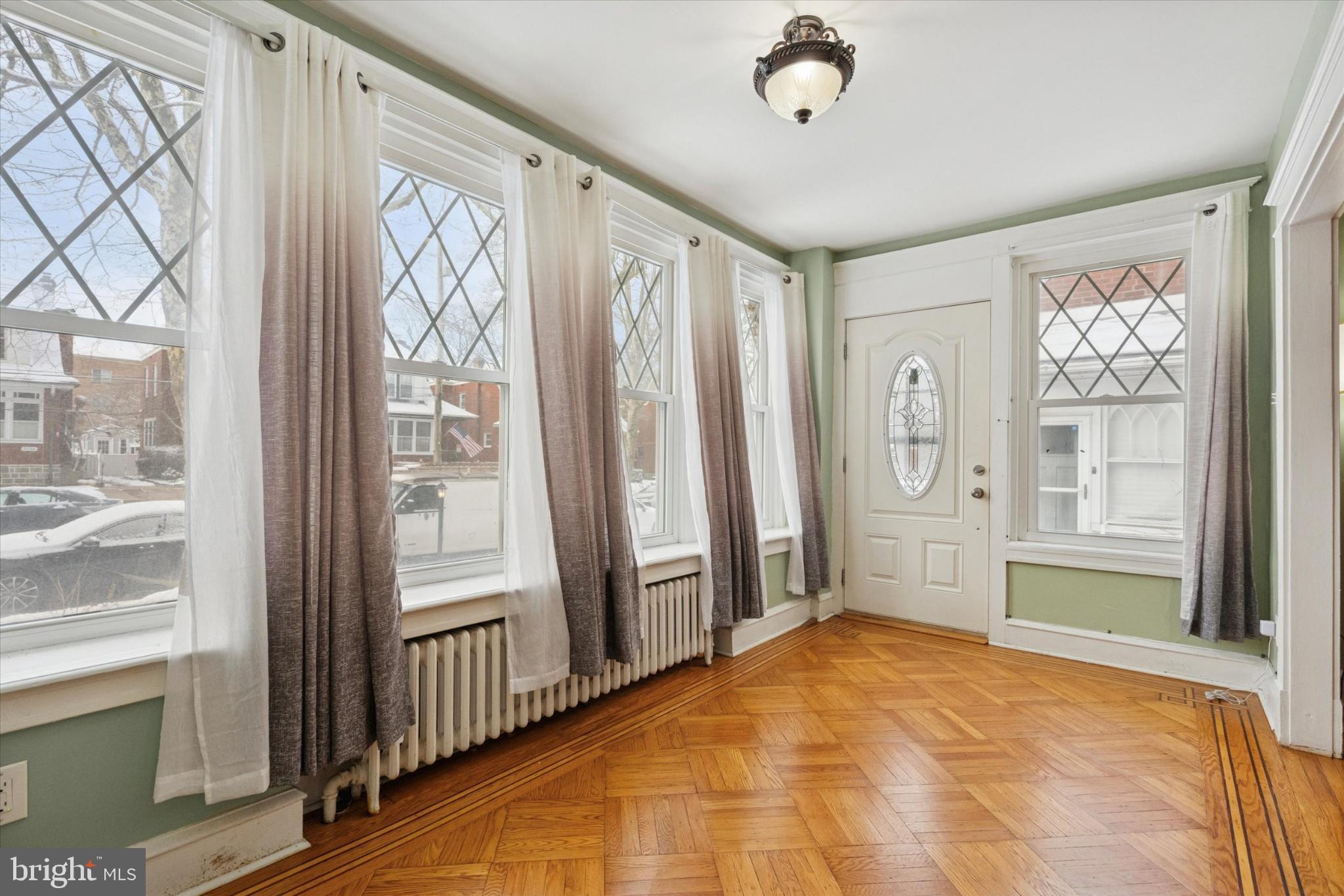 Bright entryway with elegant diamond windows.