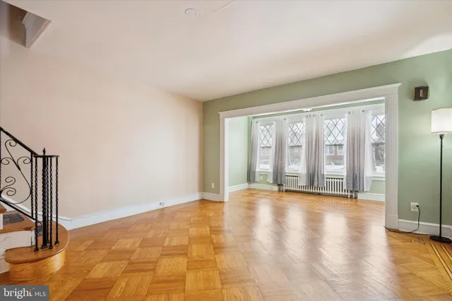 a view of an empty room with glass door