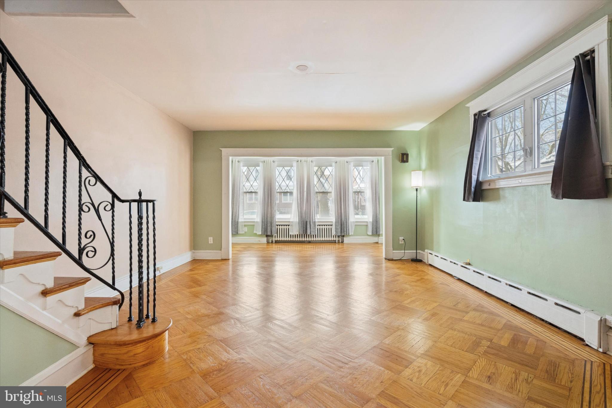 3227 Fuller Street Philadelphia, PA 19136 - Photo 7 of 25 Spacious room with elegant staircase charm.