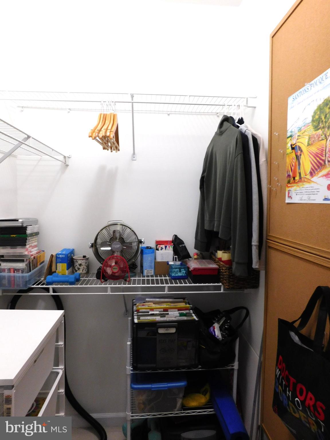 1855 Stratford Park Place, Unit 103 Reston, VA 20190 - Photo 28 of 49 2nd Bedroom organized closet.
