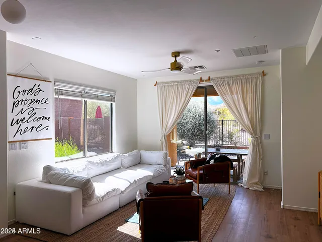 a living room with furniture and a large window