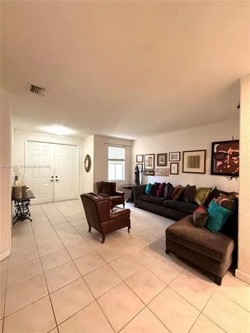 a living room with furniture and a couch