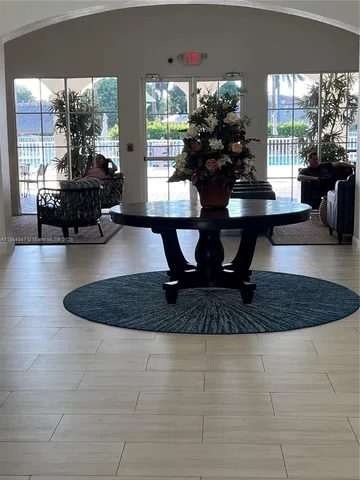 a view of living room filled with furniture and rug floor