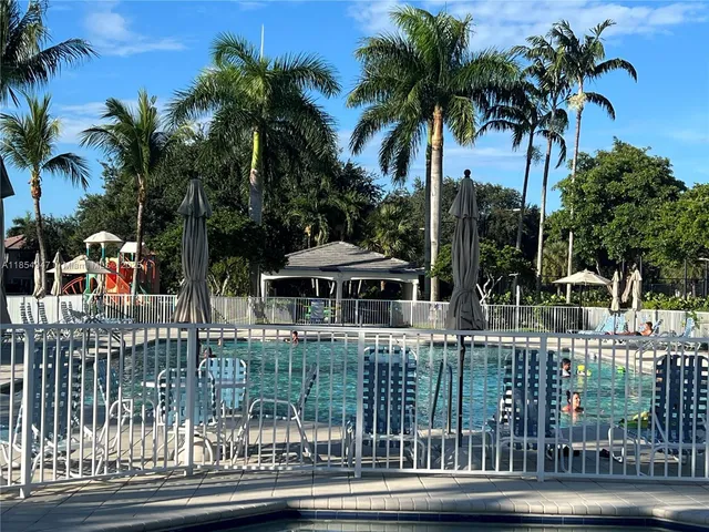 a view of swimming pool from a lake