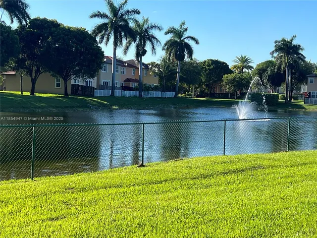 a view of a park with swings and slides