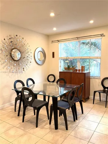 a view of a dining table and chairs in a room