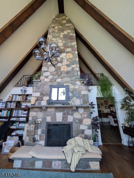 156 Lott Road Wantage, NJ 07461 - Photo 13 of 44 a living room with fireplace furniture and a wooden floor