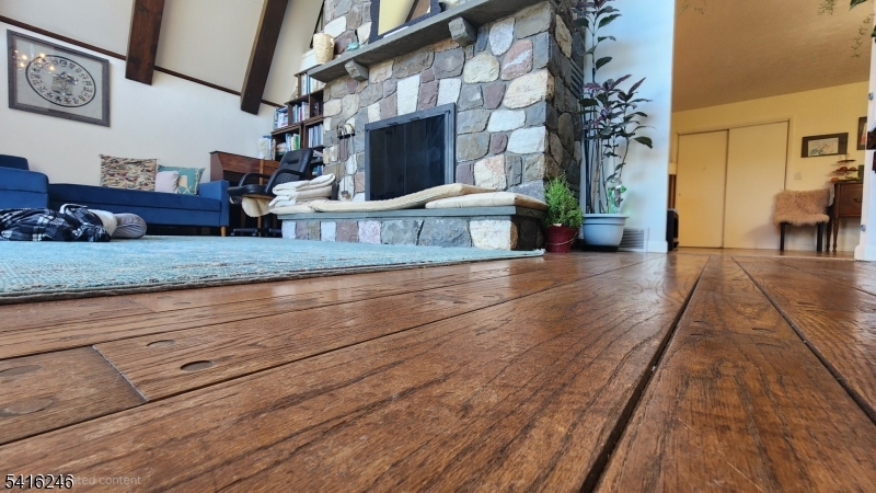 156 Lott Road Wantage, NJ 07461 - Photo 15 of 44 a view of living room kitchen with furniture and a fireplace