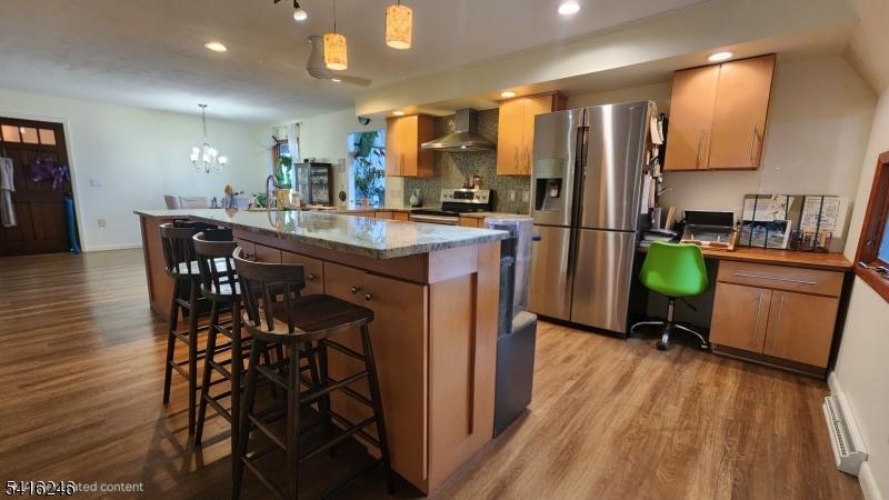 156 Lott Road Wantage, NJ 07461 - Photo 20 of 44 a kitchen with a table chairs refrigerator and a sink