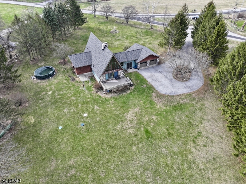 156 Lott Road Wantage, NJ 07461 - Photo 35 of 44 a view of a house with a yard porch and sitting area