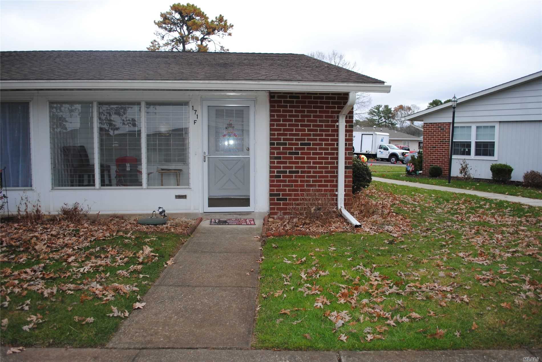 171 F Ventry Court, Unit 55 Ridge, NY 11961 - Photo 1 of 1 front view of a house with a yard