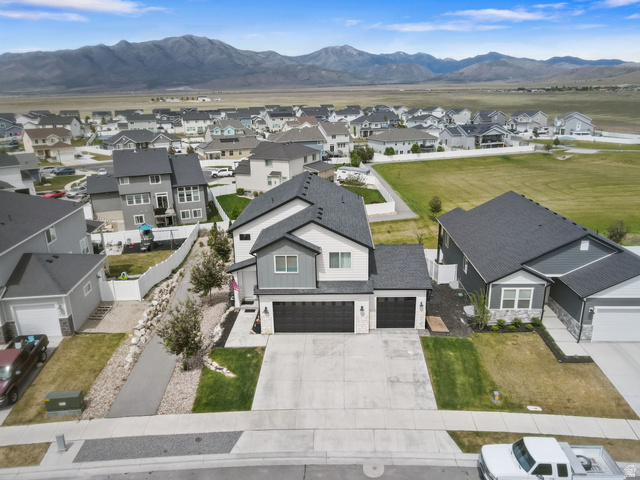 7889 Bristlecone Road Eagle Mountain, UT 84005 - Photo 5 of 42 Contemporary two-story residence featuring a gray and white exterior with dark roofline