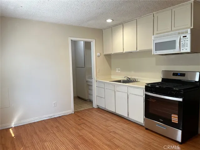 a kitchen with a stove and a sink