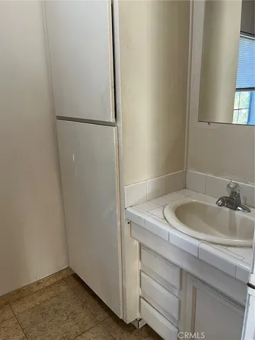 a bathroom with a sink and washing machine