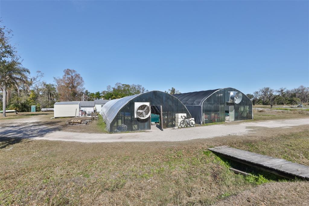 20112 Hobbs Road Wimauma, FL 33598 - Photo 58 of 94 a view of a yard with a house