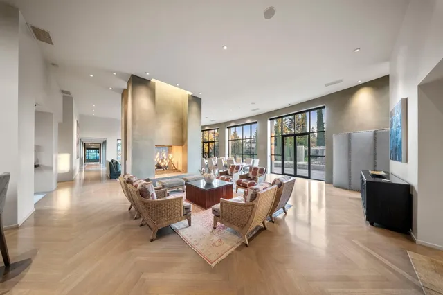 a bed room with large bed and a large window