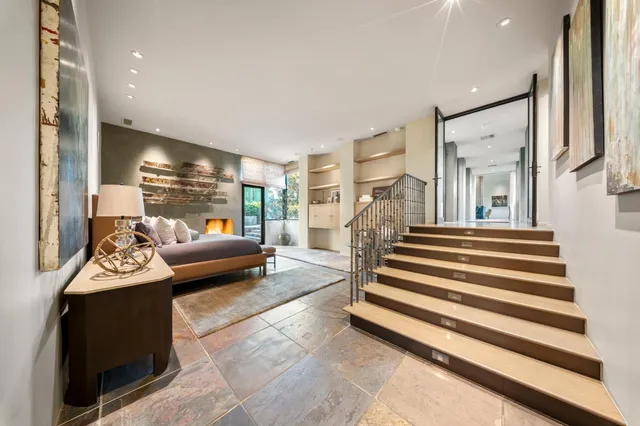 a kitchen with stainless steel appliances granite countertop a refrigerator and a stove top oven