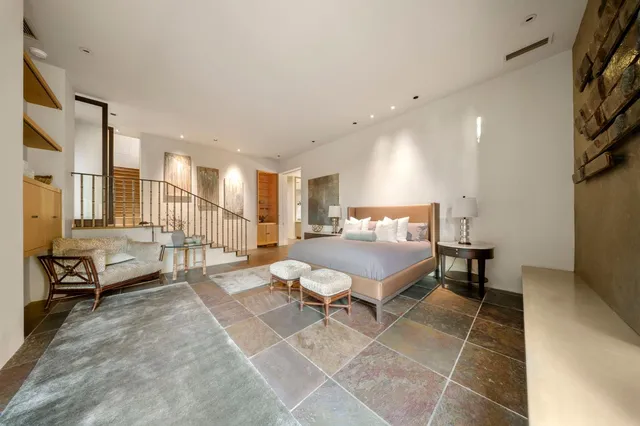 a bathroom with a granite countertop sink a toilet and bathtub