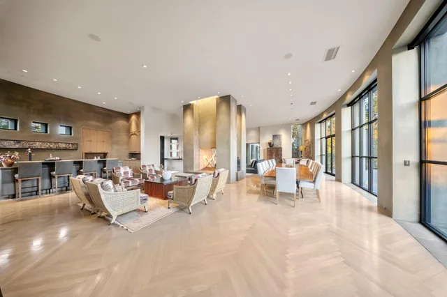 a spacious bedroom with a bed and large window