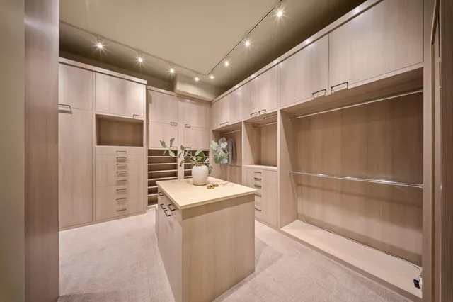 a view of a street with a houses in the background