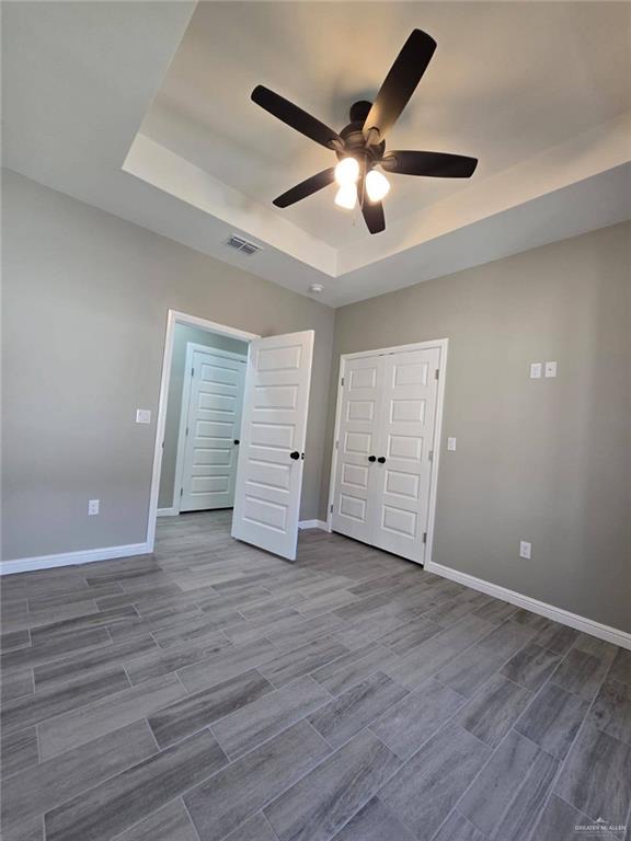 1204 Cornerstone Loop Rio Grande City, TX 78582 - Photo 5 of 15 an empty room with wooden floor and windows
