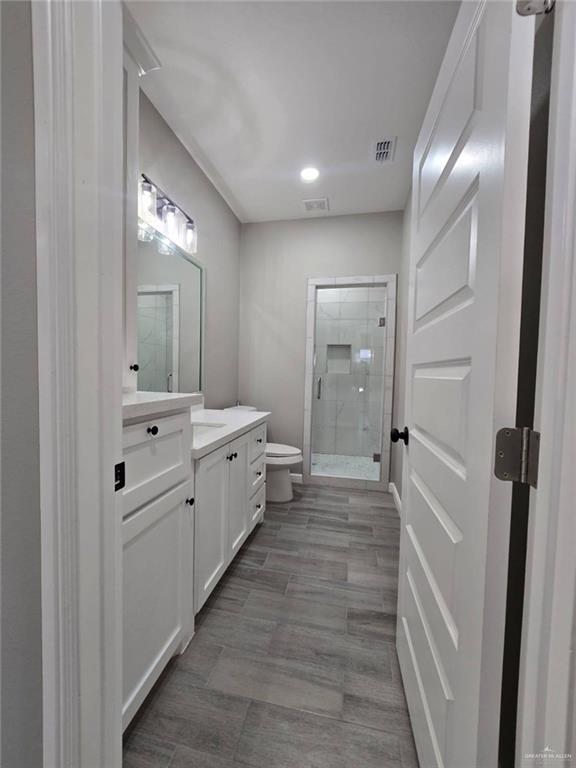 1204 Cornerstone Loop Rio Grande City, TX 78582 - Photo 6 of 15 a bathroom with a sink a mirror and a shower
