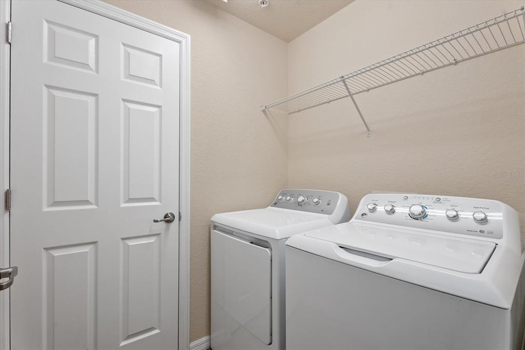 20080 Ragazza Circle, Unit 102 Venice, FL 34293 - Photo 30 of 49 a utility room with dryer and washer