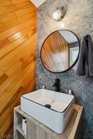 a bathroom with a sink and mirror