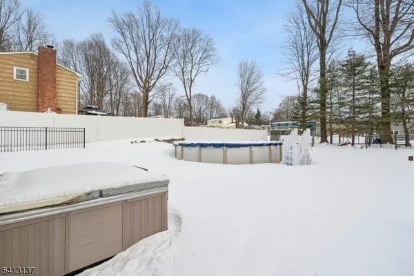 a view of a house with snow in the background