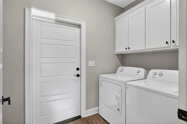 a view of storage and utility room with washer and dryer