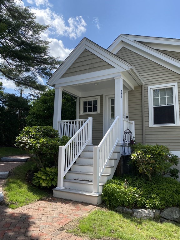 6 Essex Road, Unit 16 Ipswich, MA 01938 - Photo 2 of 14 a front view of a house with a yard