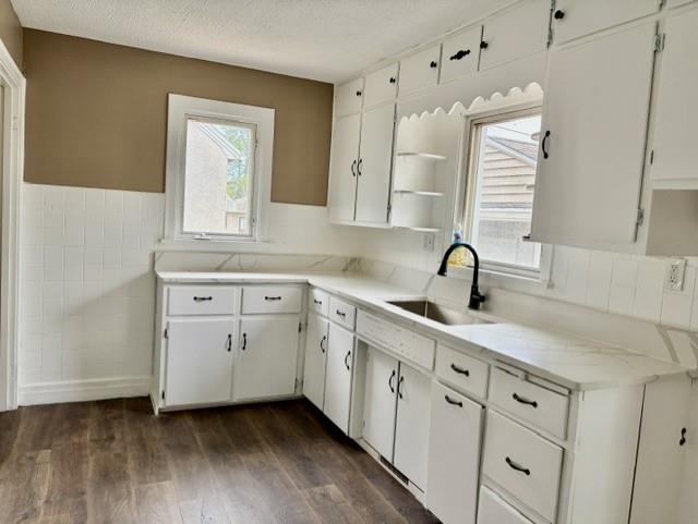 325 West 3rd Street Spring Valley, IL 61362 - Photo 5 of 11 a kitchen with white cabinets and sink
