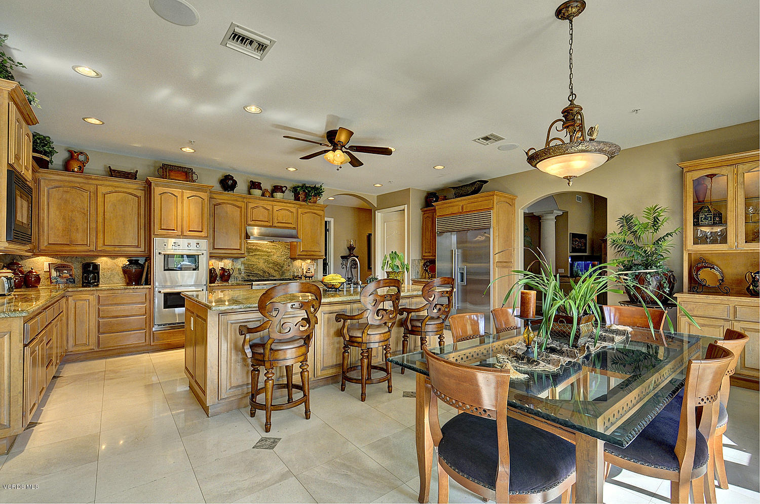 11186 Red Barn Road Camarillo, CA 93012 - Photo 12 of 41 a very nice looking dining room with a large glass table and chairs