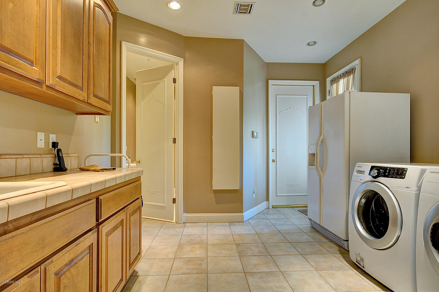 11186 Red Barn Road Camarillo, CA 93012 - Photo 24 of 41 a view of a storage and utility room with washer and dryer