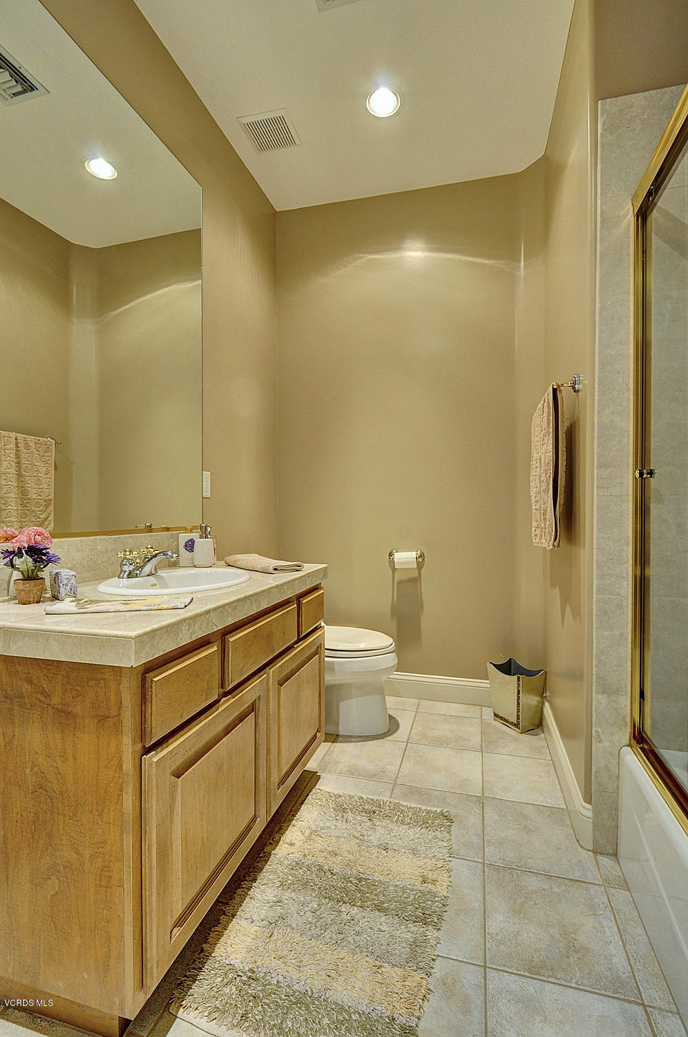 11186 Red Barn Road Camarillo, CA 93012 - Photo 26 of 41 a bathroom with a sink a toilet and shower