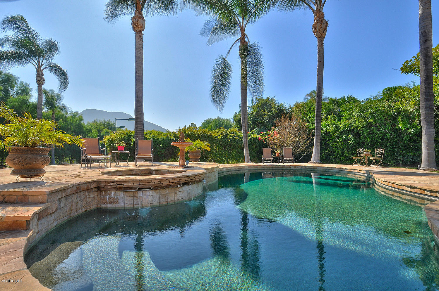 11186 Red Barn Road Camarillo, CA 93012 - Photo 34 of 41 a view of a swimming pool with a lawn chairs and a small yard