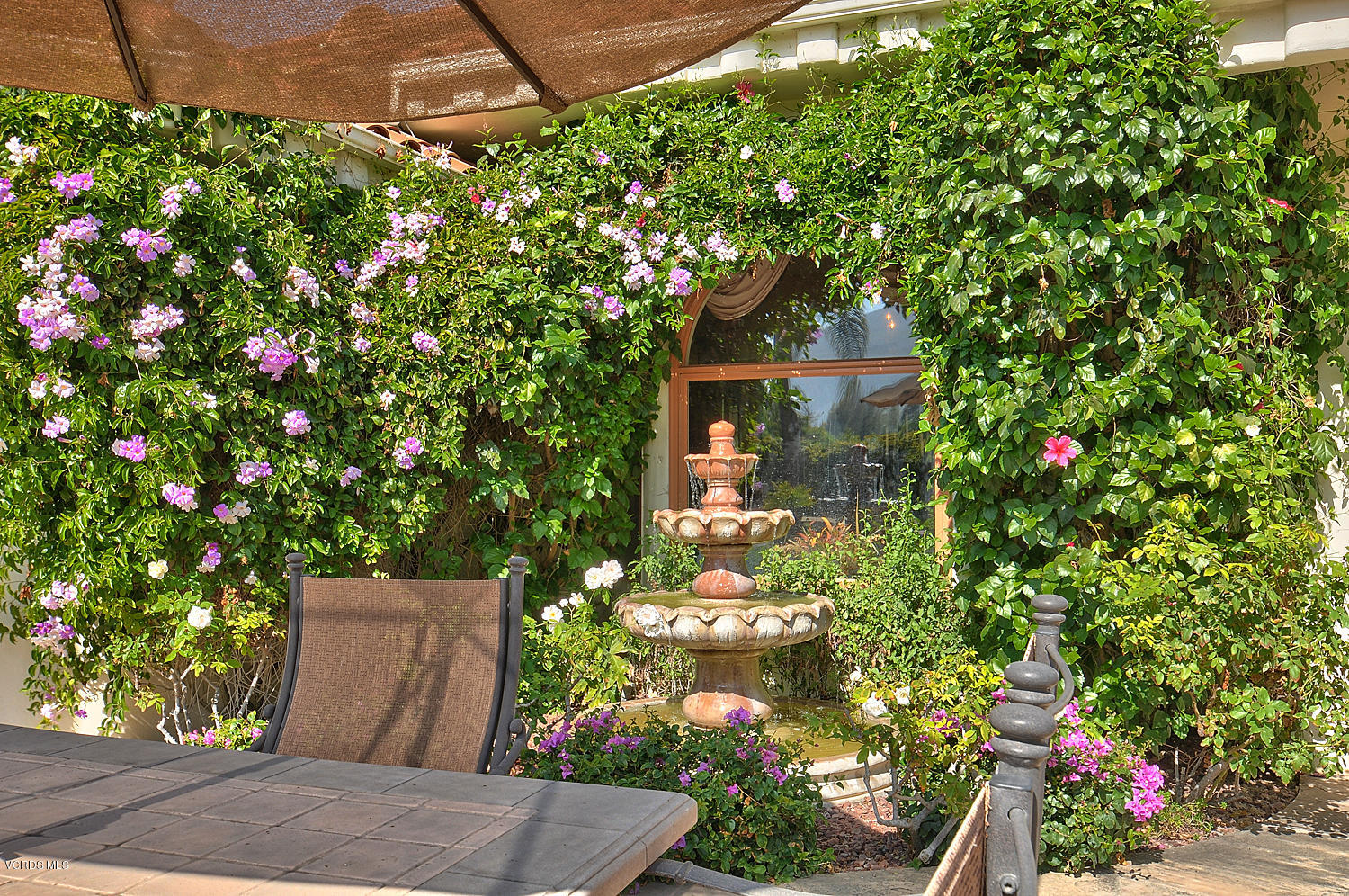 11186 Red Barn Road Camarillo, CA 93012 - Photo 36 of 41 a backyard of a house with lots of green space and fountain