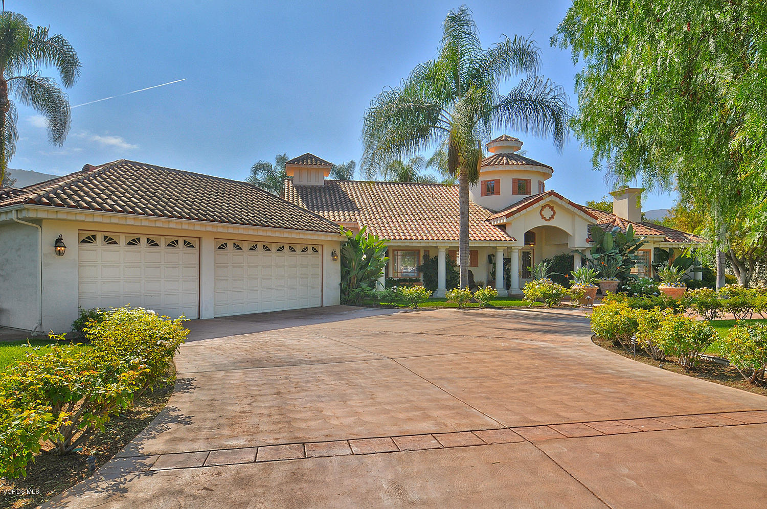 11186 Red Barn Road Camarillo, CA 93012 - Photo 5 of 41 a front view of a house with a yard and garage