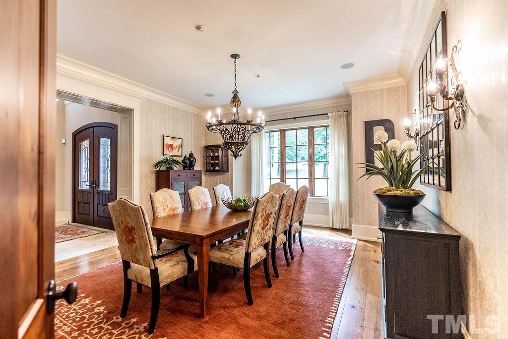 11213 Jonas Ridge Lane Raleigh, NC 27613 - Photo 18 of 100 a view of a dining room with furniture window and wooden floor