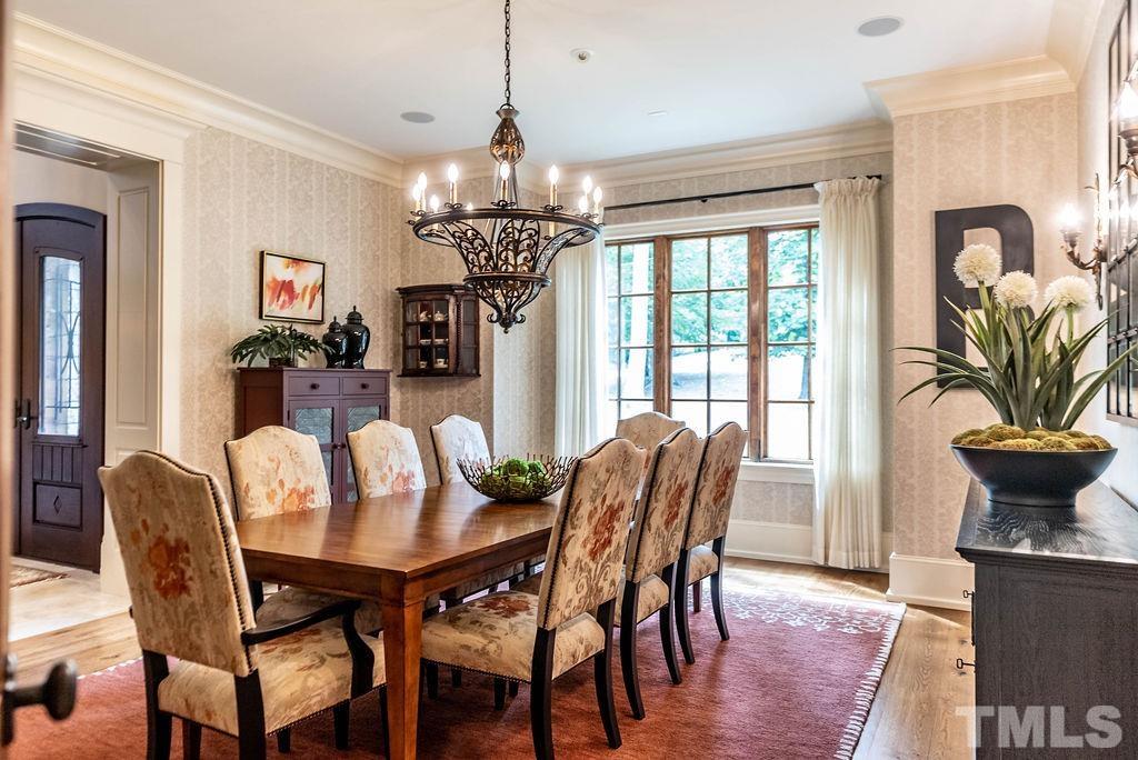 11213 Jonas Ridge Lane Raleigh, NC 27613 - Photo 19 of 100 a view of a dining room with furniture window and wooden floor
