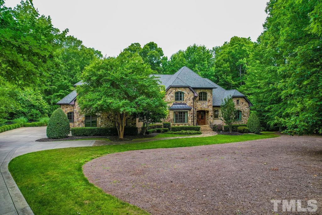 11213 Jonas Ridge Lane Raleigh, NC 27613 - Photo 2 of 100 a front view of a house with a yard and trees