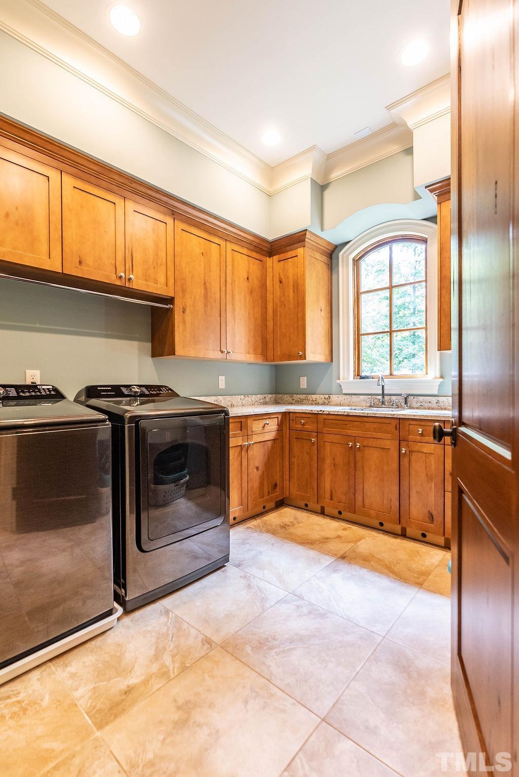 11213 Jonas Ridge Lane Raleigh, NC 27613 - Photo 38 of 100 a kitchen with a stove a sink and a refrigerator